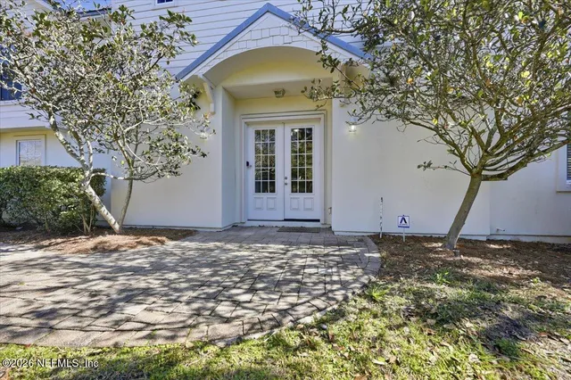 a view of a house with a tree