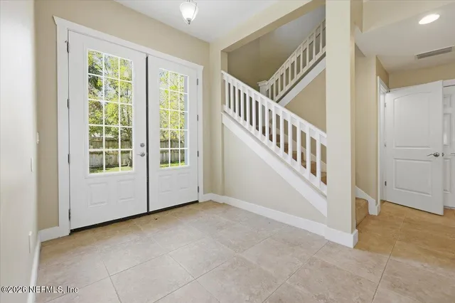 a view of an entryway with staircase