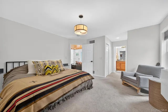 a bedroom with a bed and a couch