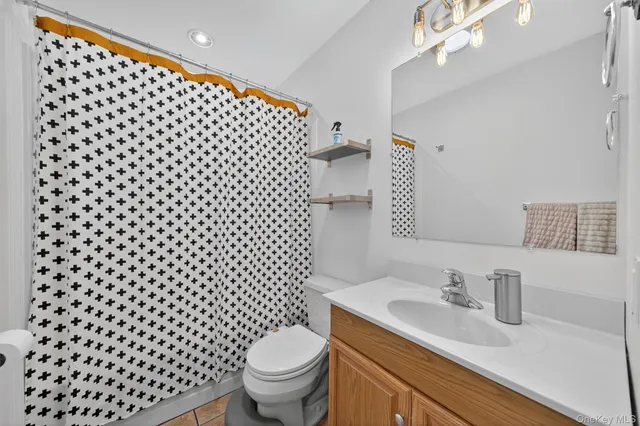 a bedroom with a bed and a desk