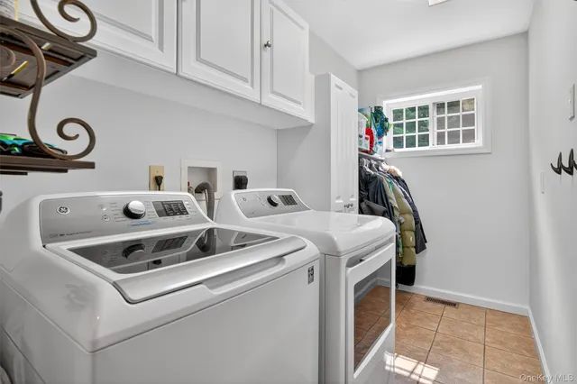 a bathroom with a sink a toilet a mirror and shower