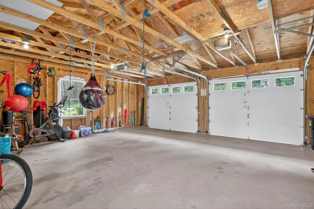 a bedroom with two beds and a desk