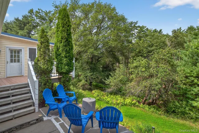 a view of a house with a chairs in patio