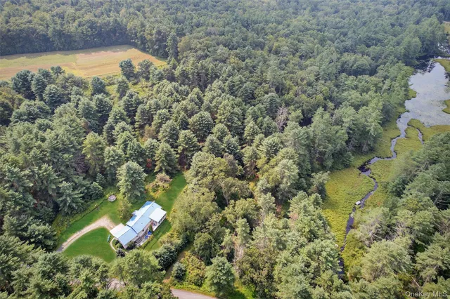 a view of a chairs and table in the balcony