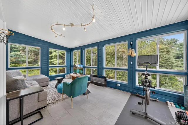 a living room with furniture and windows