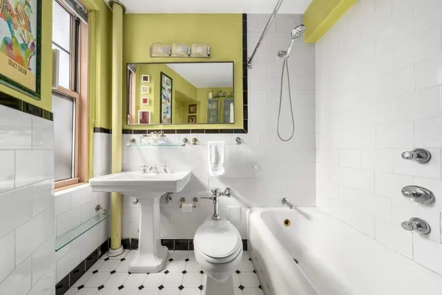 a bed room with a bed and a chair