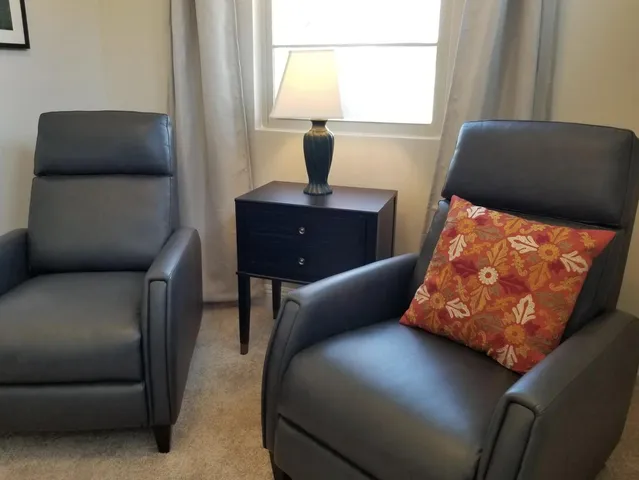 a dining room with table and chairs