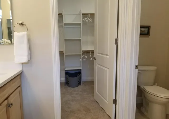 a bathroom with a double vanity sink and mirror