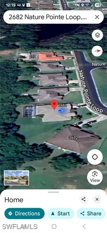 a living room with furniture a window and a chandelier