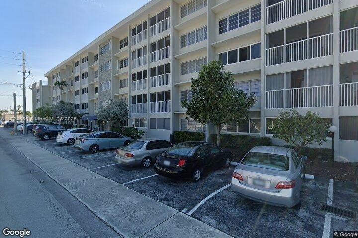 330 Southeast 2nd Street, Unit 304F Hallandale Beach, FL 33009 - Photo 1 of 2 a view of a cars parked in front of a building