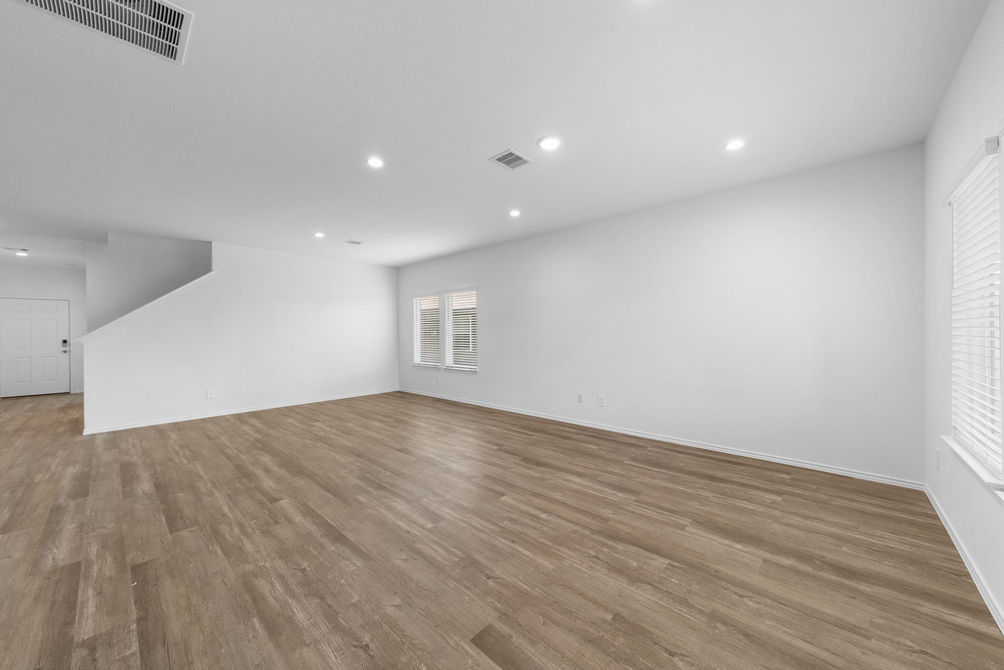 16727 Hemlock Forest Lane Magnolia, TX 77355 - Photo 11 of 35 a view of an empty room with wooden floor and a window