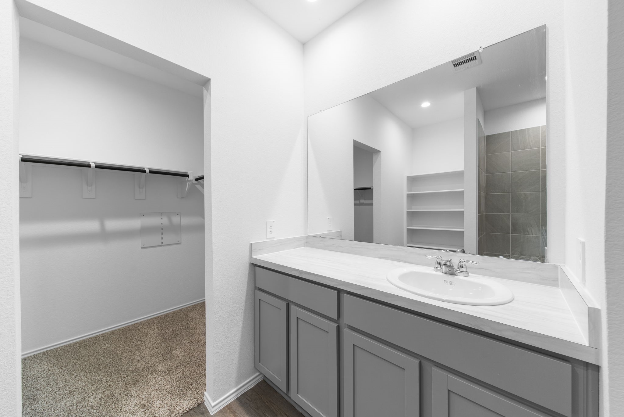 16727 Hemlock Forest Lane Magnolia, TX 77355 - Photo 17 of 35 a bathroom with a sink and a mirror