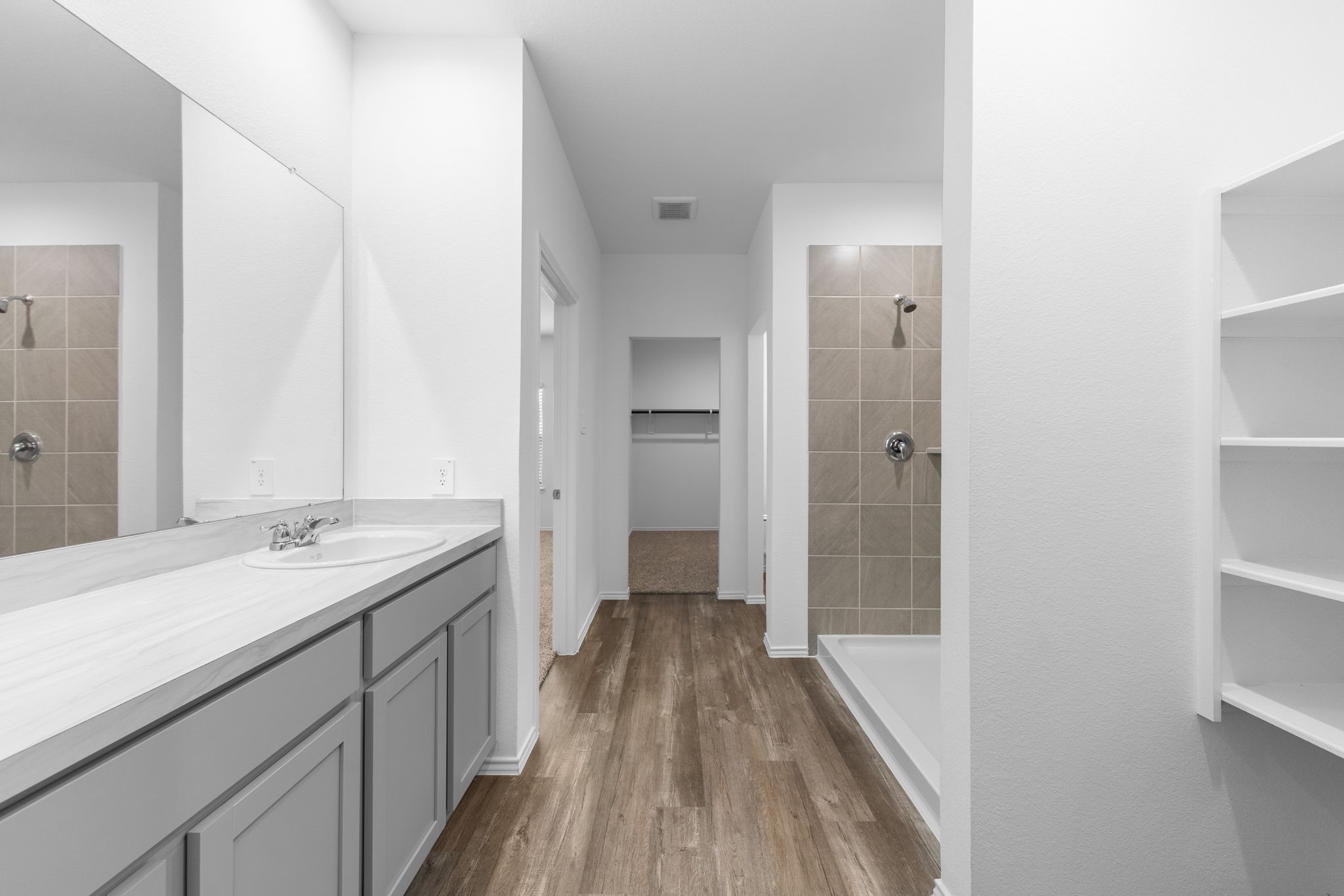 16727 Hemlock Forest Lane Magnolia, TX 77355 - Photo 18 of 35 a bathroom with a sink and a mirror
