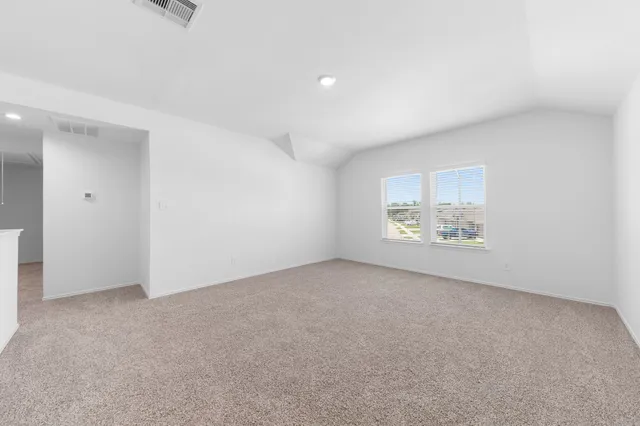 an empty room with a empty space and a window