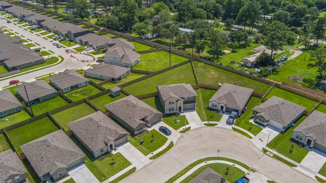 an aerial view of a house with a swimming pool