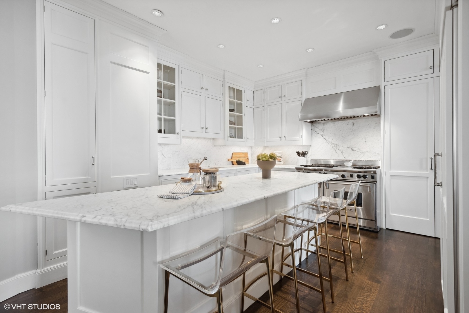3400 North Lake Shore Drive, Unit 3A Chicago, IL 60657 - Photo 12 of 25 a kitchen with a sink a stove and chairs