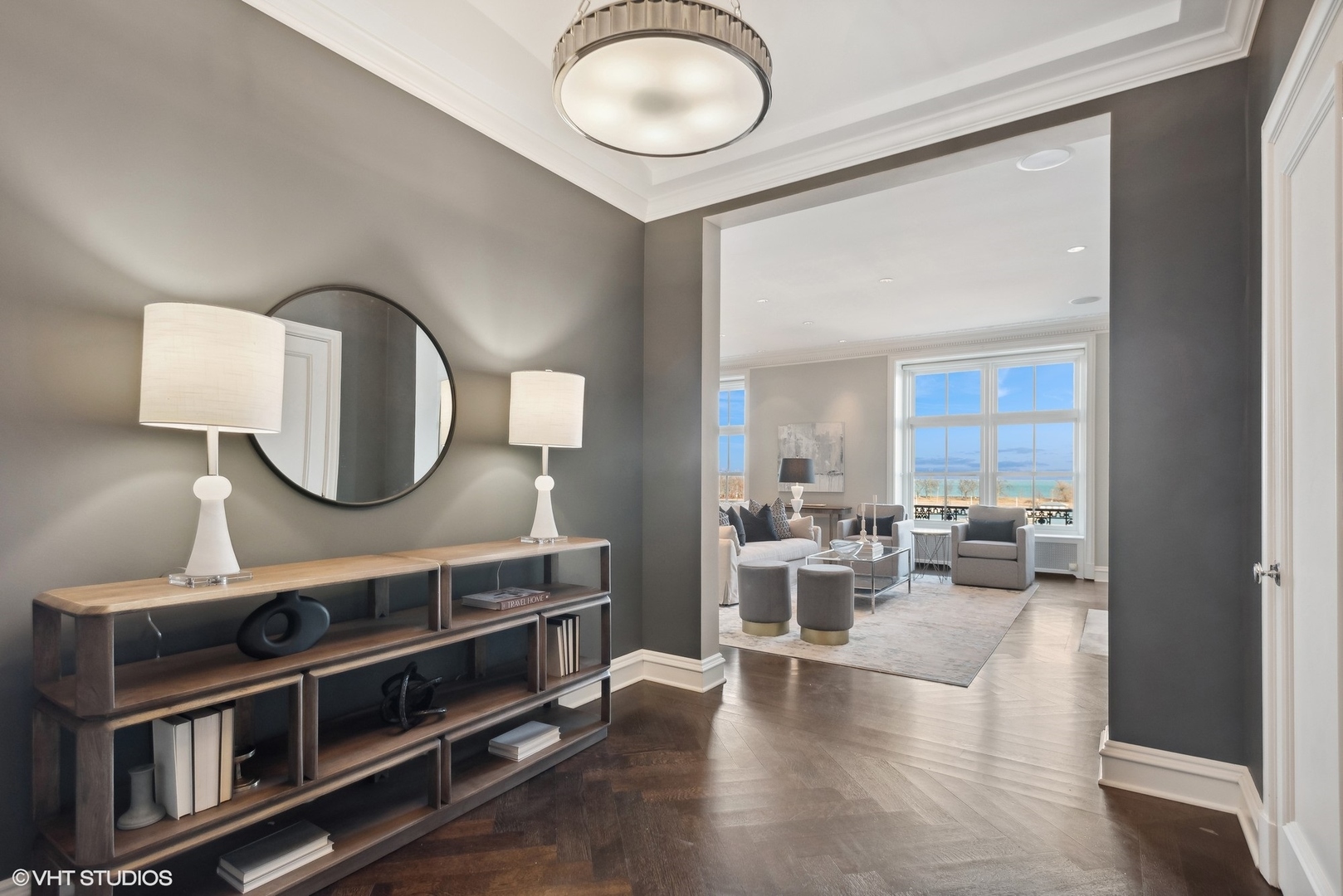 3400 North Lake Shore Drive, Unit 3A Chicago, IL 60657 - Photo 16 of 25 a view of living room with kitchen island stainless steel appliances and wooden floor