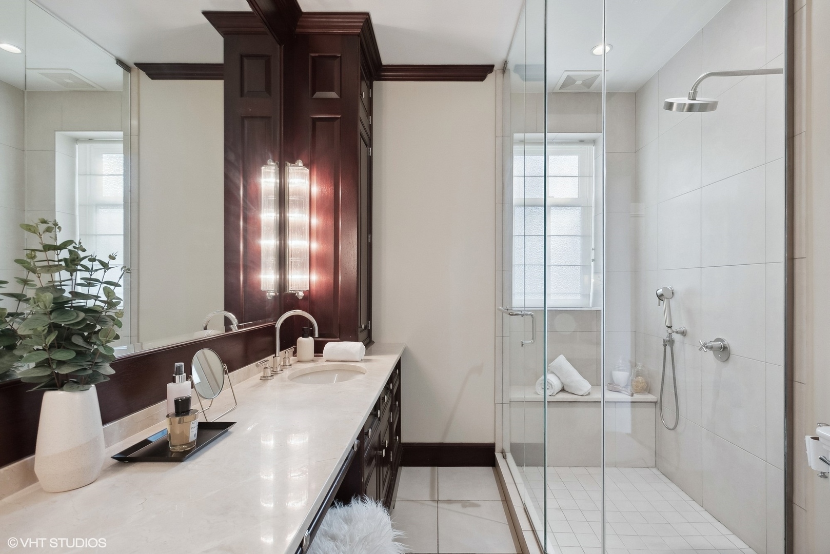 3400 North Lake Shore Drive, Unit 3A Chicago, IL 60657 - Photo 23 of 25 a bathroom with a sink and mirror