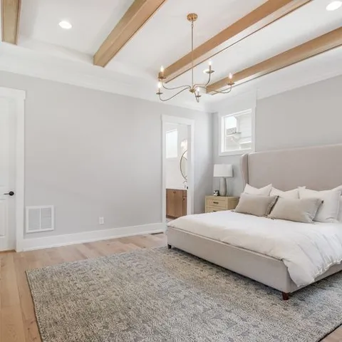 a bedroom with a bed and a couch