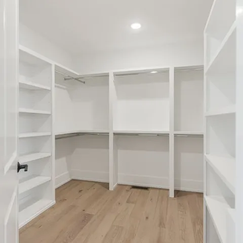 a view of an empty walk in closet