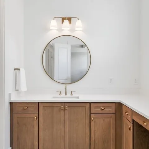 a closeup of a sink and a mirror