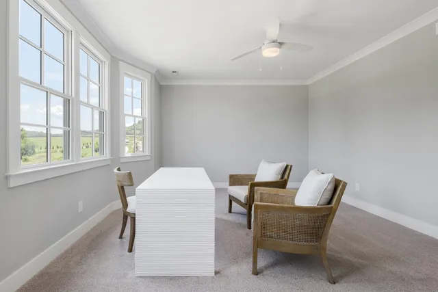 a work room with furniture and windows