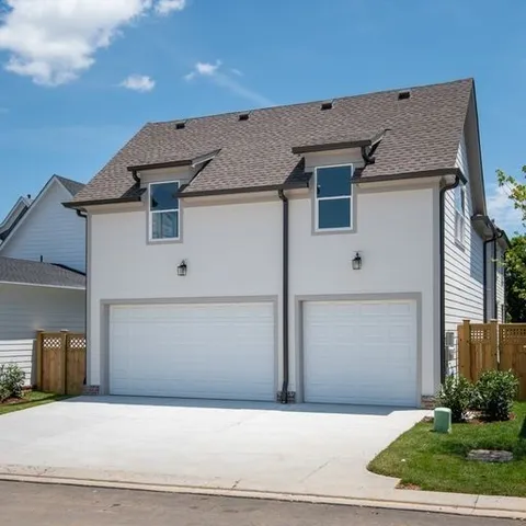 a front view of a house with garage