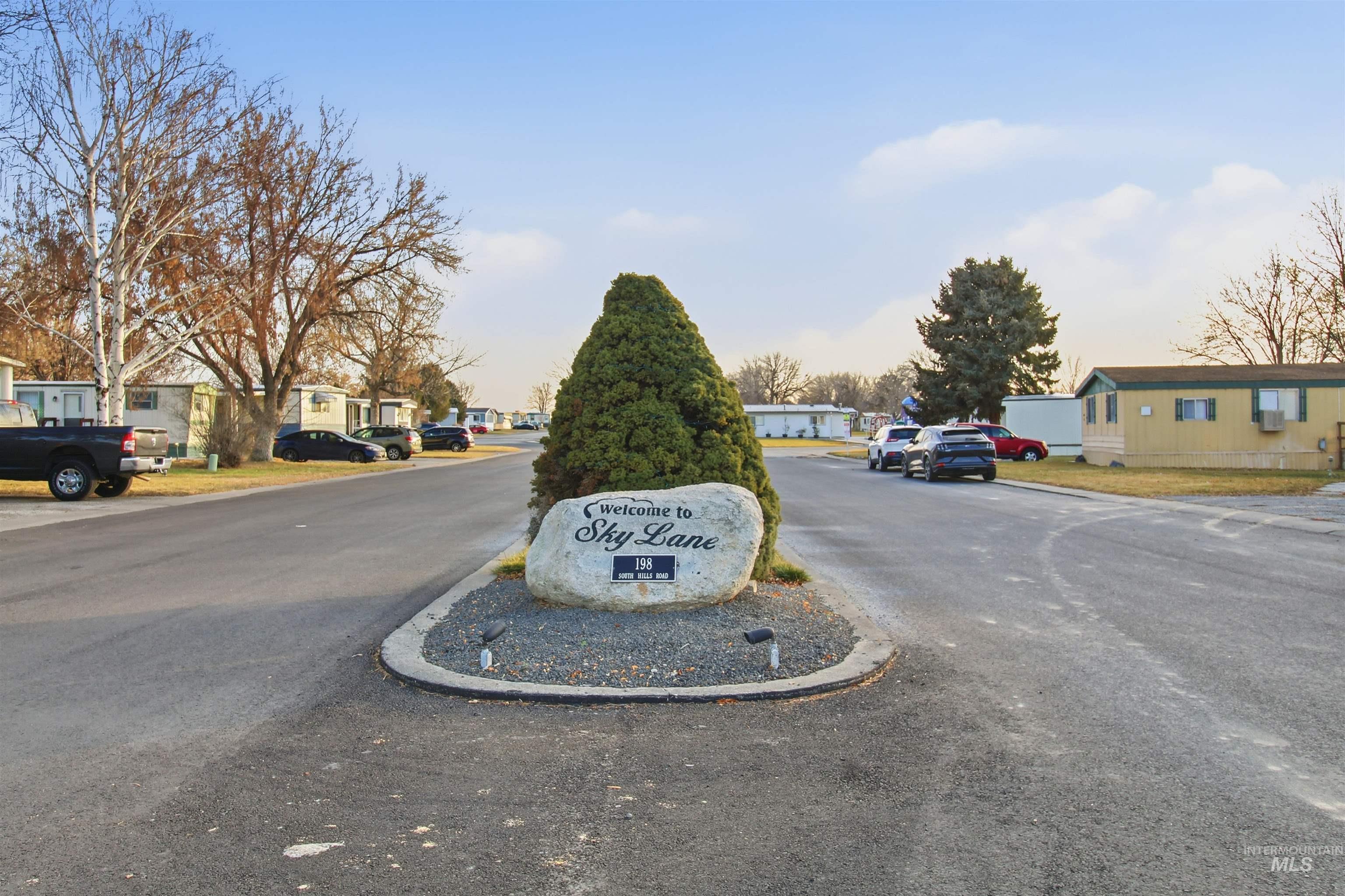 198 South Hills Road, Unit 43 Twin Falls, ID 83301 - Photo 19 of 25 View of asphalt road featuring a residential view and curbs