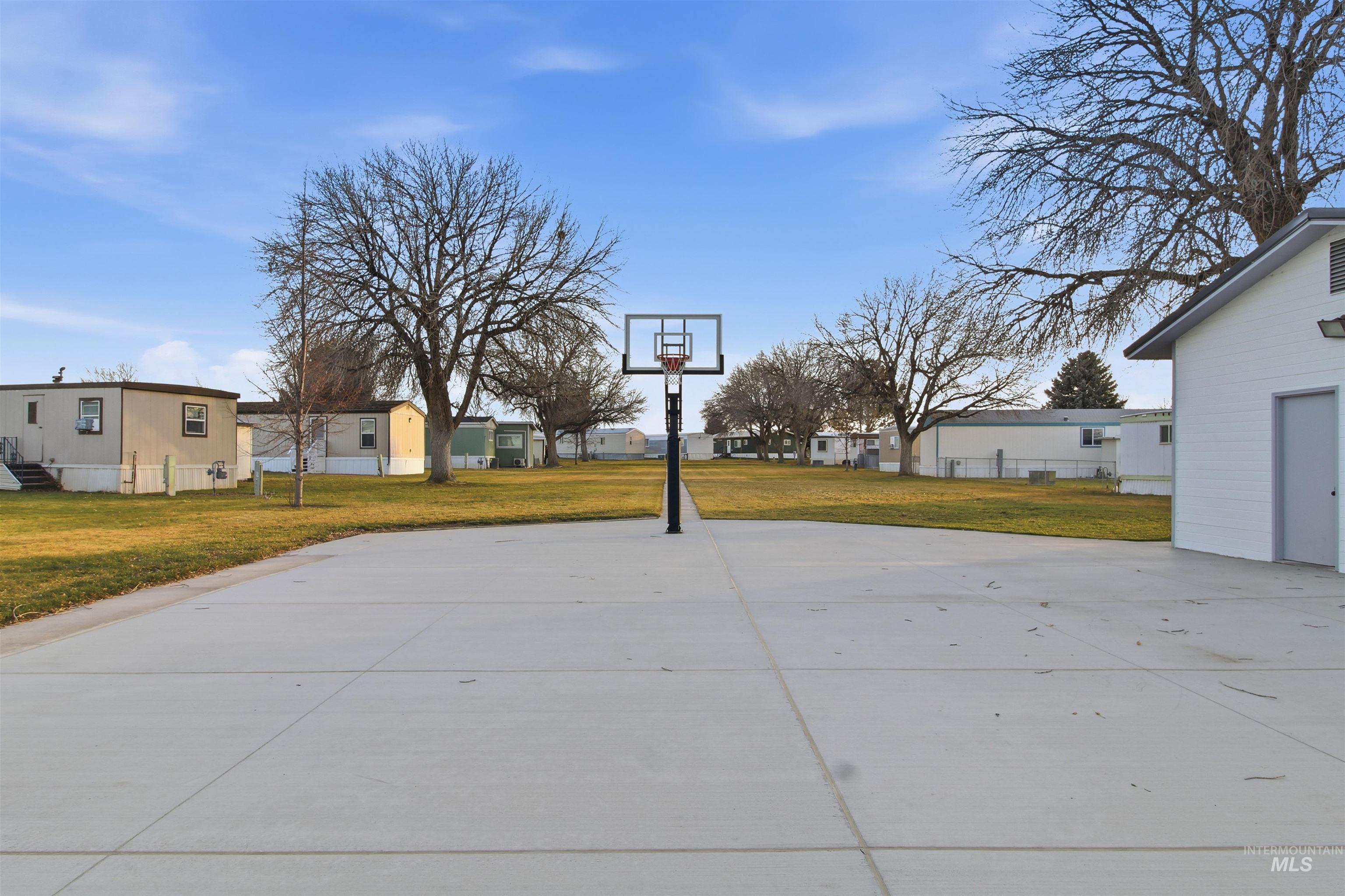 198 South Hills Road, Unit 43 Twin Falls, ID 83301 - Photo 22 of 25 View of patio / terrace featuring a residential view and basketball hoop