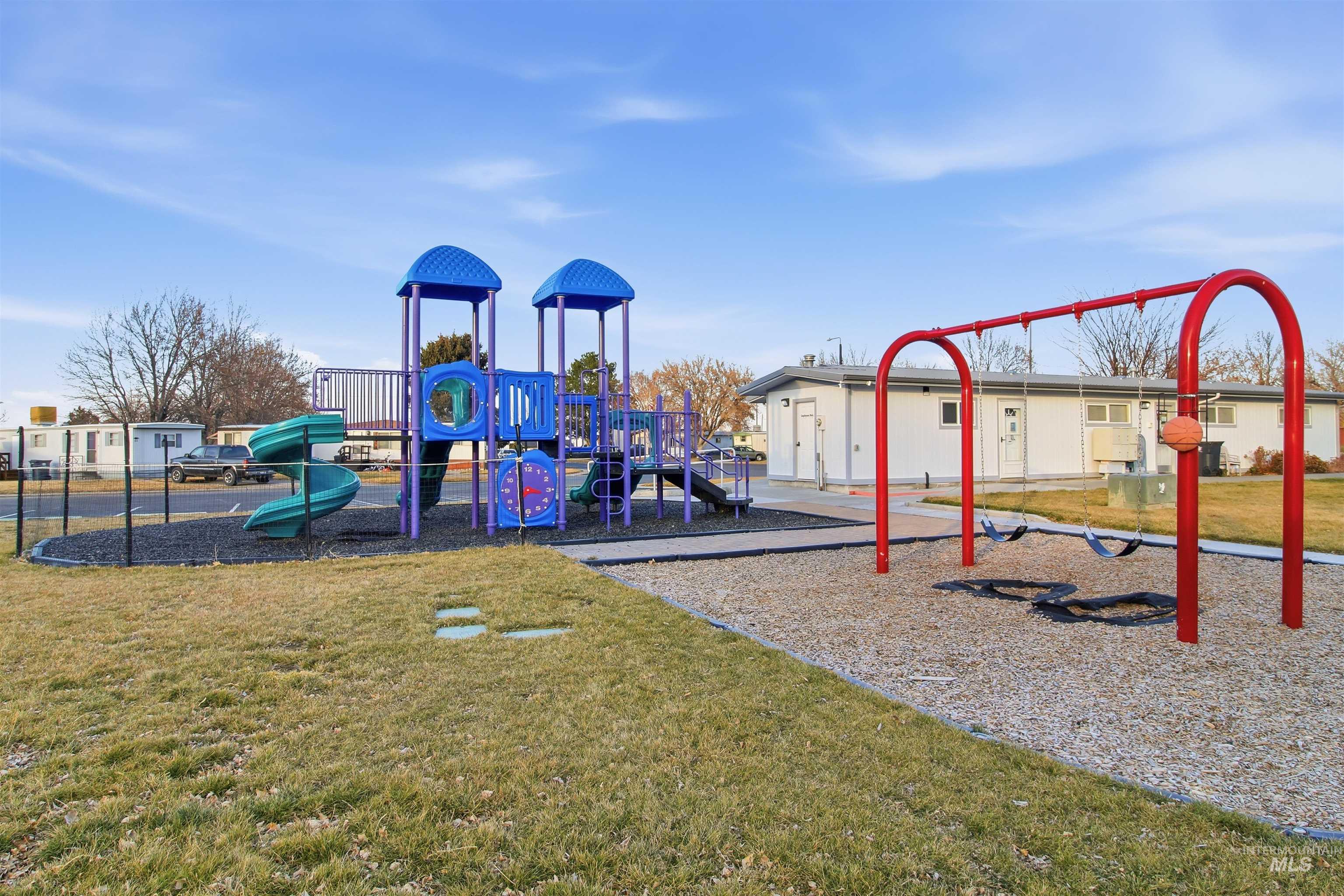 198 South Hills Road, Unit 43 Twin Falls, ID 83301 - Photo 23 of 25 Community playground featuring a yard