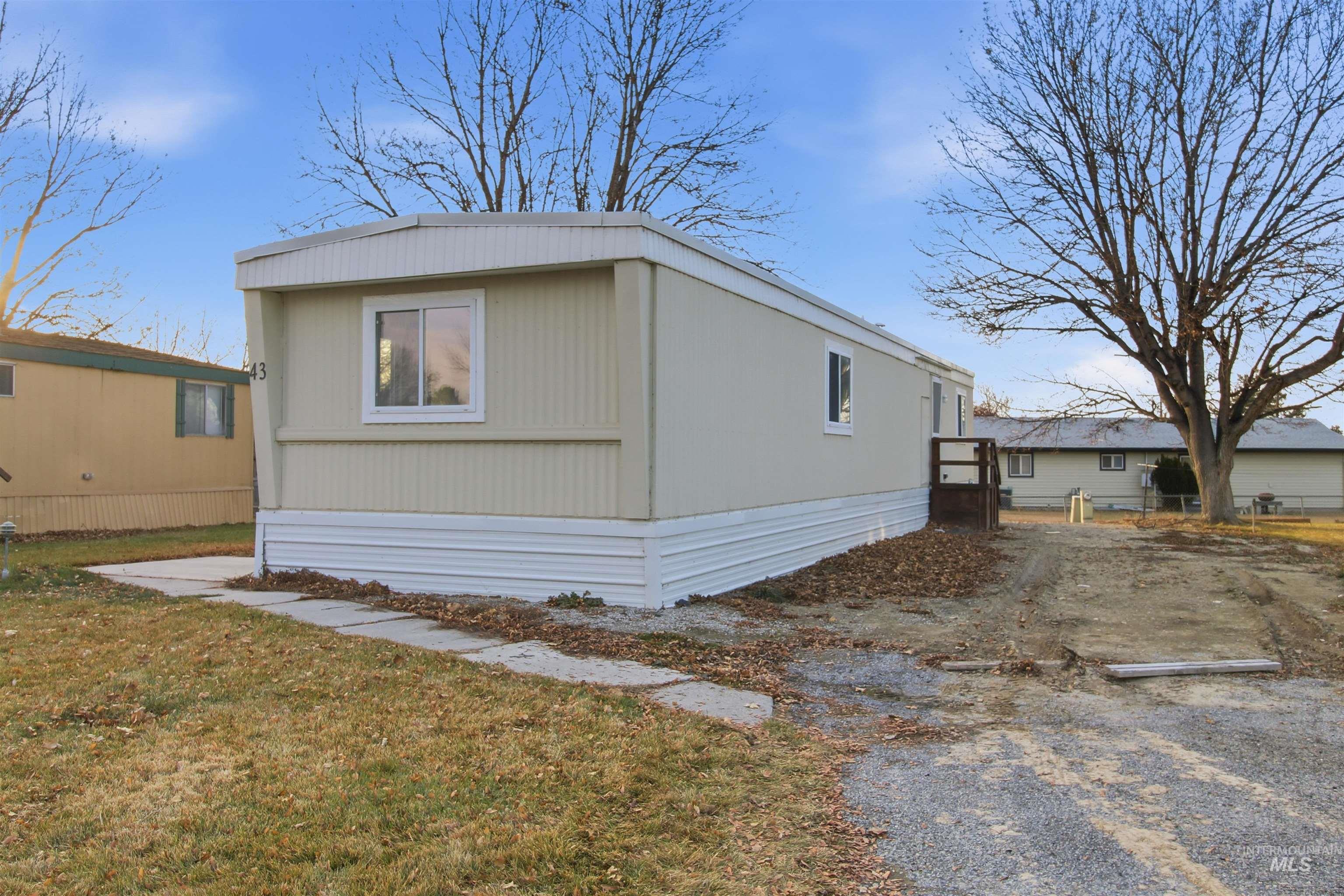 198 South Hills Road, Unit 43 Twin Falls, ID 83301 - Photo 25 of 25 View of side of property with a yard
