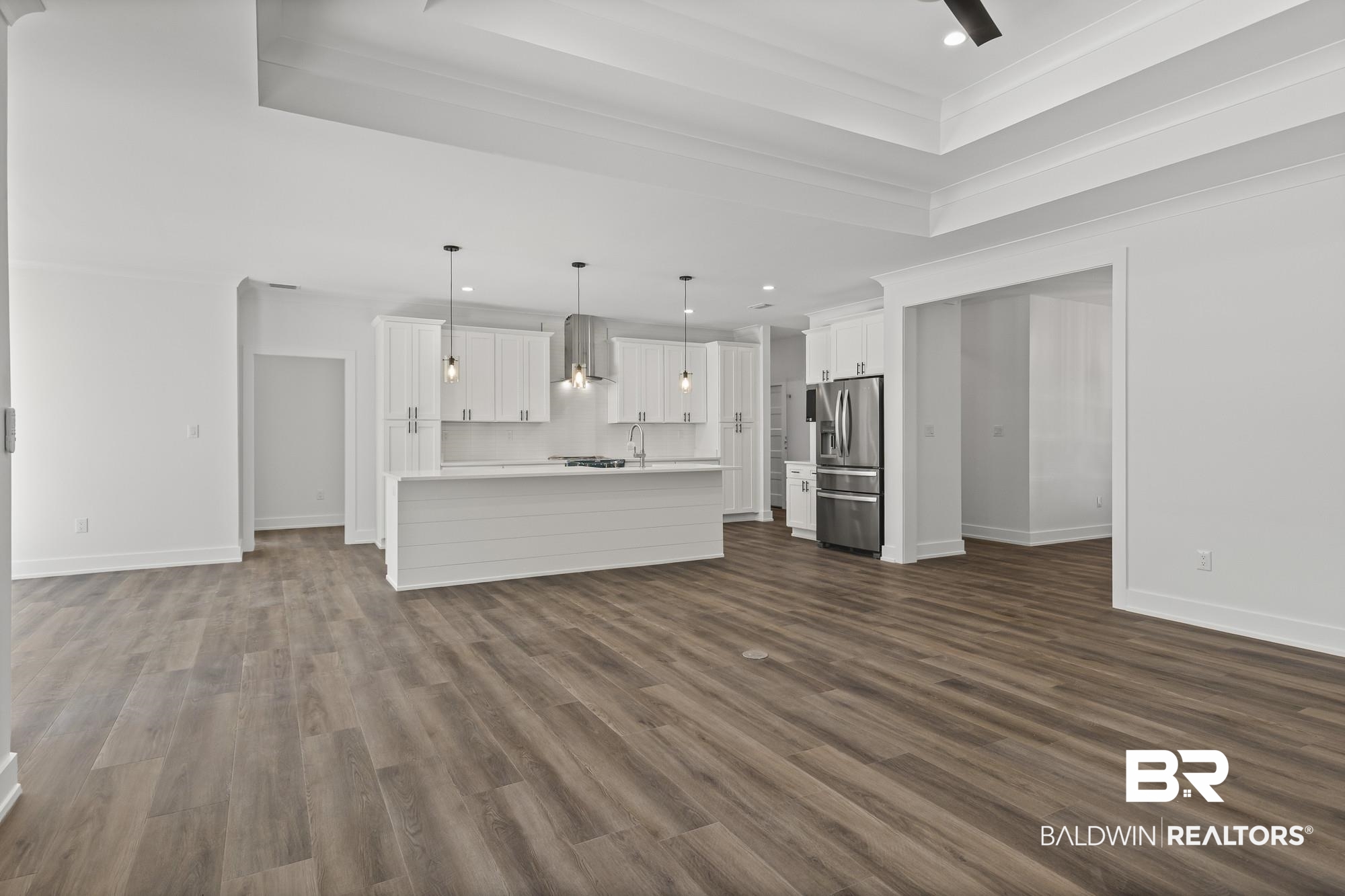 10180 Pineview Drive Foley, AL 36535 - Photo 13 of 47 Unfurnished living room with recessed lighting, dark wood finished floors, and crown molding
