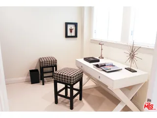 a kitchen with a table and chairs