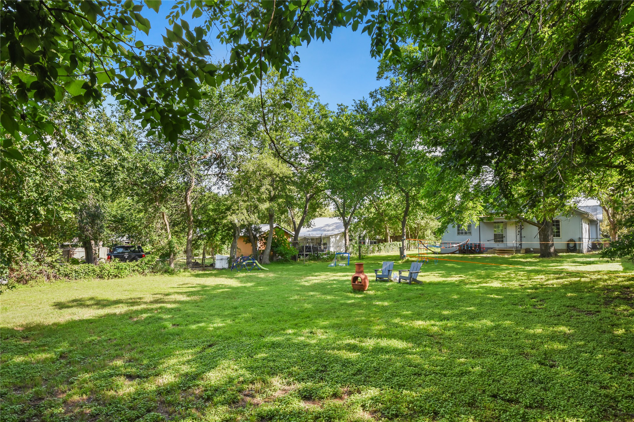 528 Old McDade Road Elgin, TX 78621 - Photo 34 of 40 The variety of trees provide verdancy and shade throughout the yard