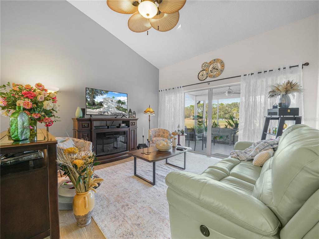 414 Eagle Ridge Drive, Unit 414 Davenport, FL 33837 - Photo 6 of 28 a living room with furniture flowerpot and a window