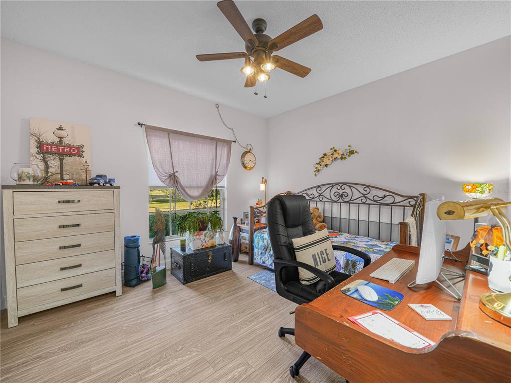 414 Eagle Ridge Drive, Unit 414 Davenport, FL 33837 - Photo 10 of 28 a living room with furniture and a wooden floor