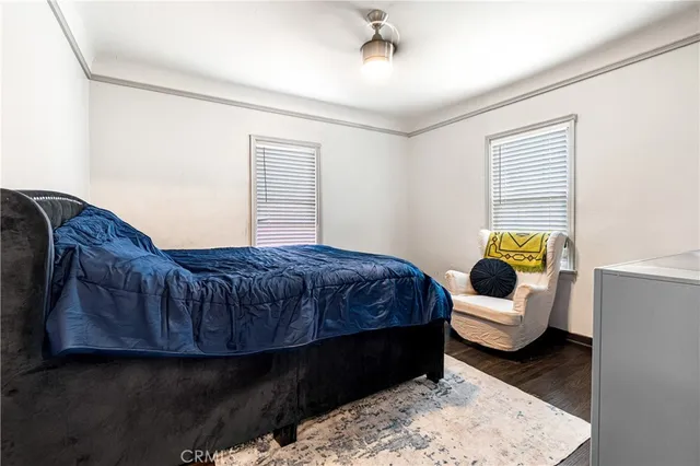 a bedroom with a bed and a couch