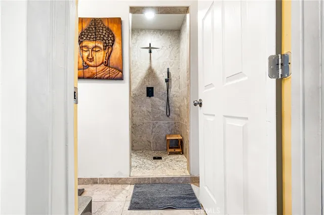 a bathroom with a shower and a sink