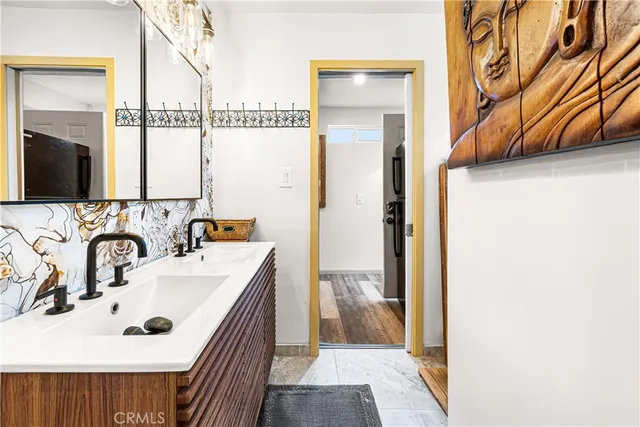 a bathroom with a sink and a mirror