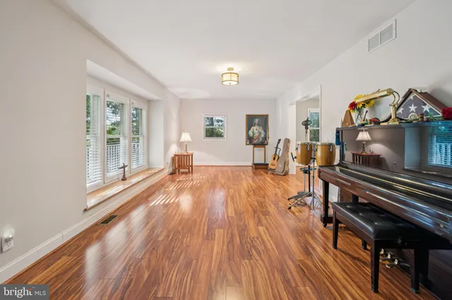 a view of a living room and wooden floor