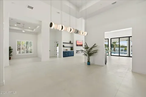 a large kitchen with stainless steel appliances kitchen island a large counter top and a sink