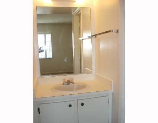 608 Northwest 13th Street, Unit 28 Boca Raton, FL 33486 - Photo 11 of 14 a bathroom with a sink and a mirror