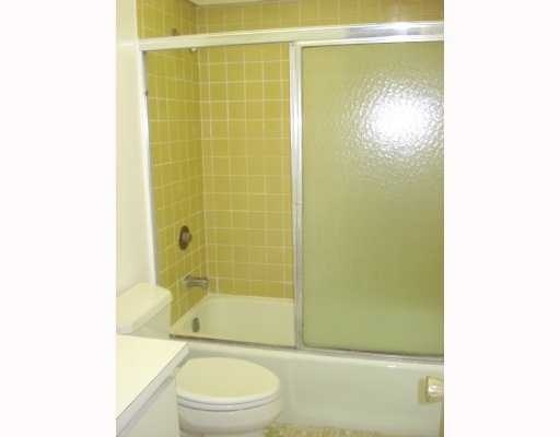 608 Northwest 13th Street, Unit 28 Boca Raton, FL 33486 - Photo 14 of 14 a bathroom with a shower a toilet and a sink