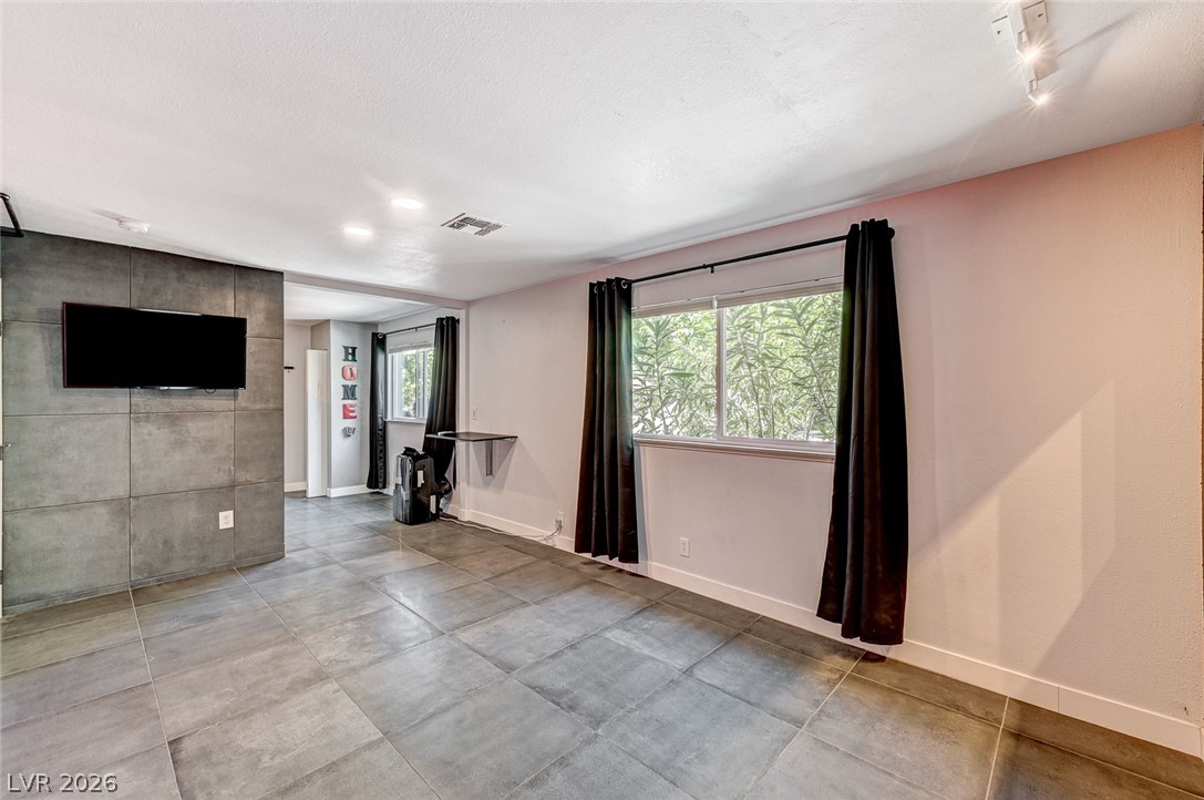 4153 Woodcrest Road Las Vegas, NV 89121 - Photo 38 of 58 Clean lines and a generous layout define this adaptable living space.