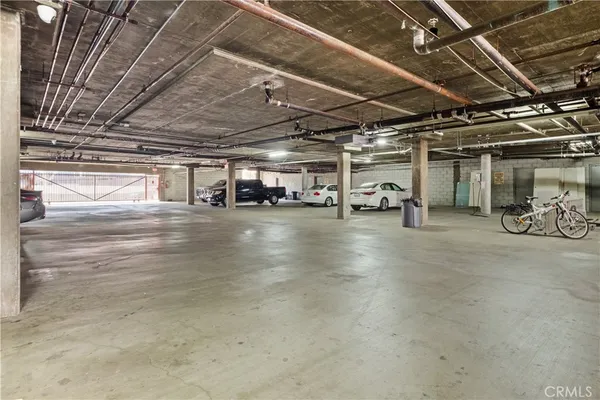 an empty room with wooden floor and a window