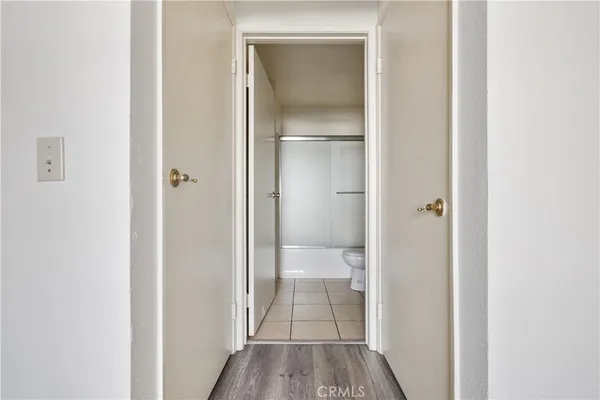 a view of a bathroom from a hallway