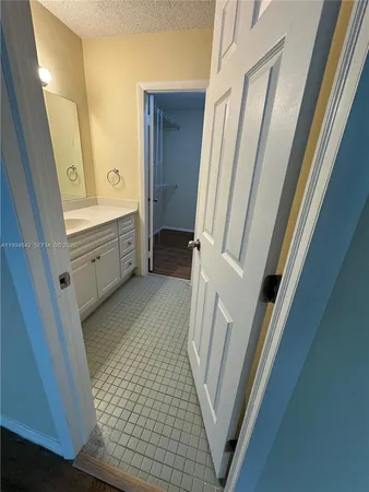 a bathroom with a vanity mirror and a sink
