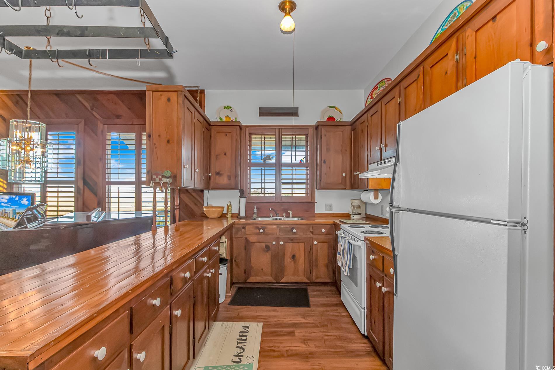 1417 Inlet Street Sunset Beach, NC 28468 - Photo 14 of 36 Kitchen featuring wooden counters, light hardwood