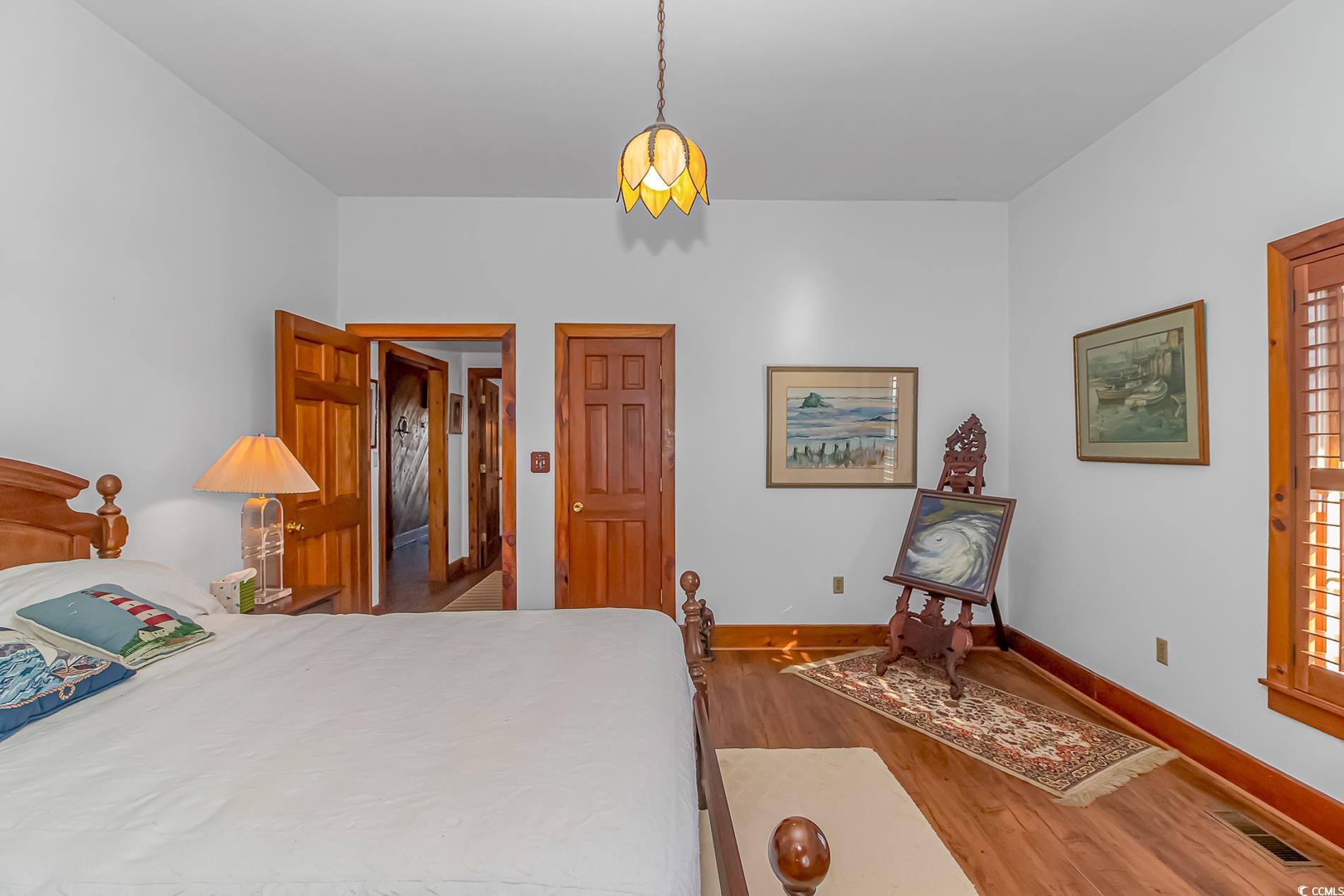 1417 Inlet Street Sunset Beach, NC 28468 - Photo 22 of 36 Bedroom featuring hardwood / wood-style floors