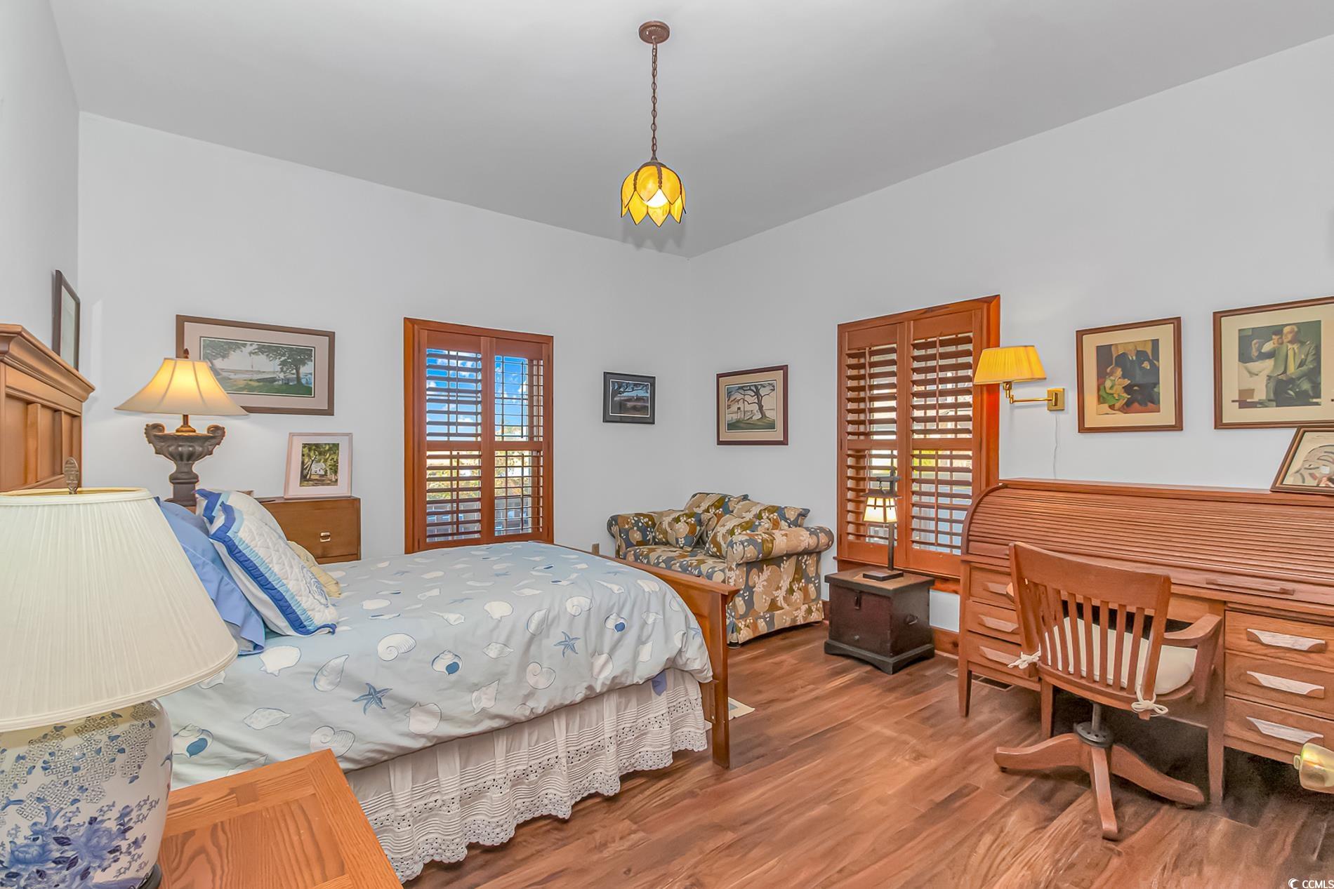 1417 Inlet Street Sunset Beach, NC 28468 - Photo 23 of 36 Bedroom featuring hardwood / wood-style flooring a